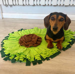 A pet enjoying the AvoSniff avocado snuffle mat